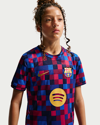 FC Barcelona Older Kids' Nike Dri-FIT Football Pre-Match Top. Nike NL